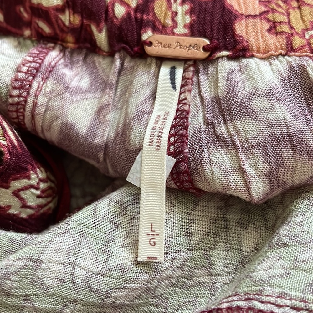 NWOT! Free People Bali Boho flare pants. Color multi reds and greens. Sizes: M,L - Picture 14 of 14
